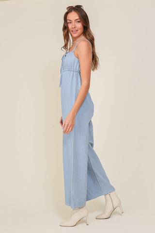 DENIM BLUE SLEEVELESS JUMPSUIT WITH SELF FRONT TIE Jumpsuits and Rompers